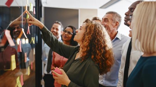 Aptia-Brand-Image_0013_Diverse businesspeople brainstor